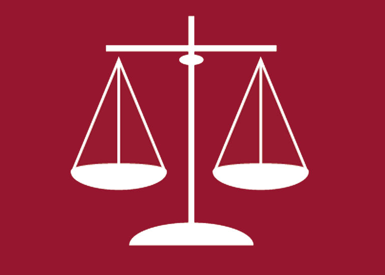 Balance scale on maroon background